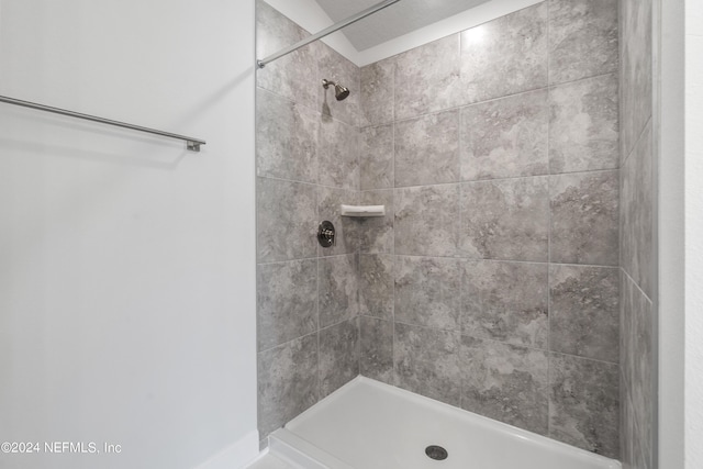 bathroom with a tile shower