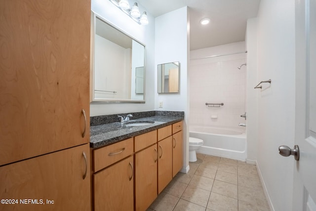 full bathroom featuring toilet, vanity, tile patterned floors, and tiled shower / bath combo