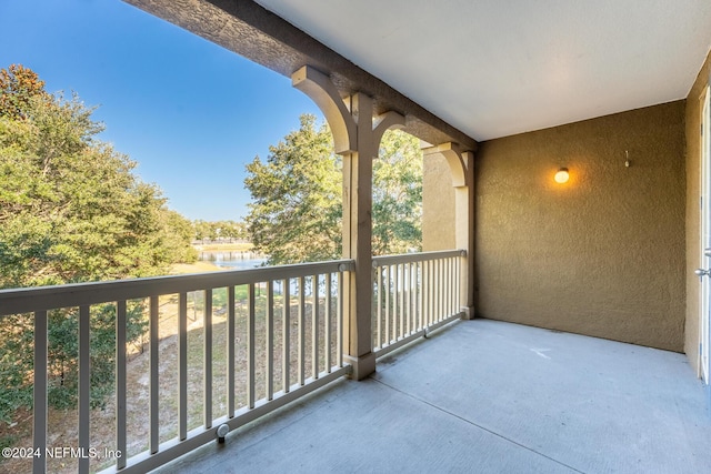 balcony featuring a water view