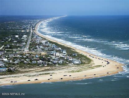 drone / aerial view with a view of the beach and a water view