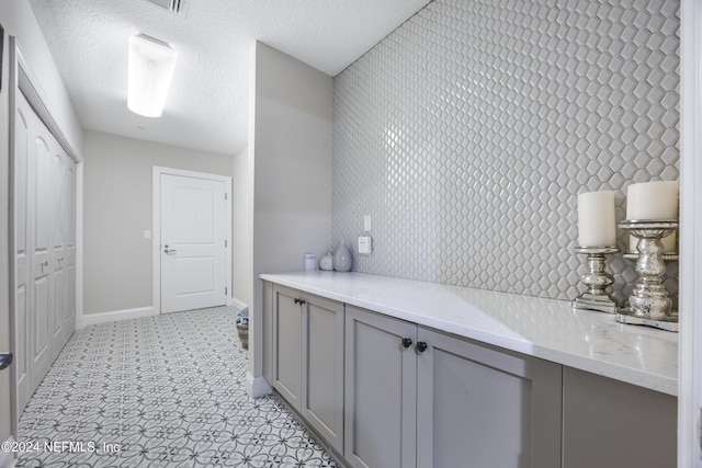 1431 Riverplace Blvd Unit 2105, Jacksonville, FL 32207 - bathroom with a textured ceiling and baseboards