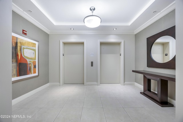 1431 Riverplace Blvd Unit 2105, Jacksonville, FL 32207 - hall featuring elevator, tile patterned flooring, and a raised ceiling