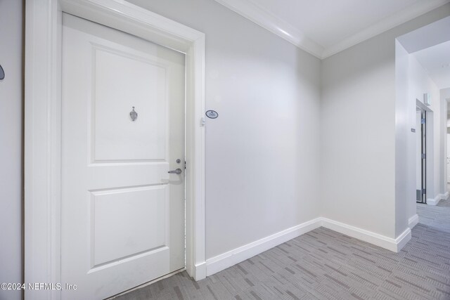 1431 Riverplace Blvd Unit 2105, Jacksonville, FL 32207 - corridor featuring light colored carpet, crown molding, and baseboards