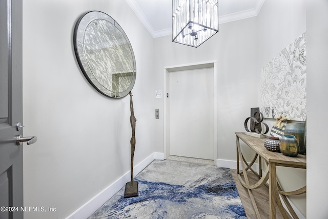 1431 Riverplace Blvd Unit 2105, Jacksonville, FL 32207 - foyer entrance featuring an inviting chandelier, crown molding, and baseboards