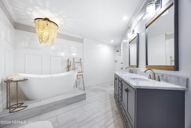 1431 Riverplace Blvd Unit 2105, Jacksonville, FL 32207 - bathroom with a notable chandelier, a freestanding tub, ornamental molding, and a sink