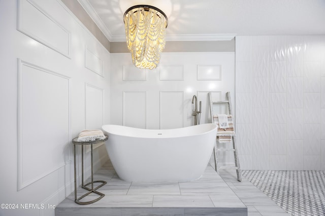 1431 Riverplace Blvd Unit 2105, Jacksonville, FL 32207 - bathroom featuring a chandelier, a decorative wall, a freestanding bath, and crown molding