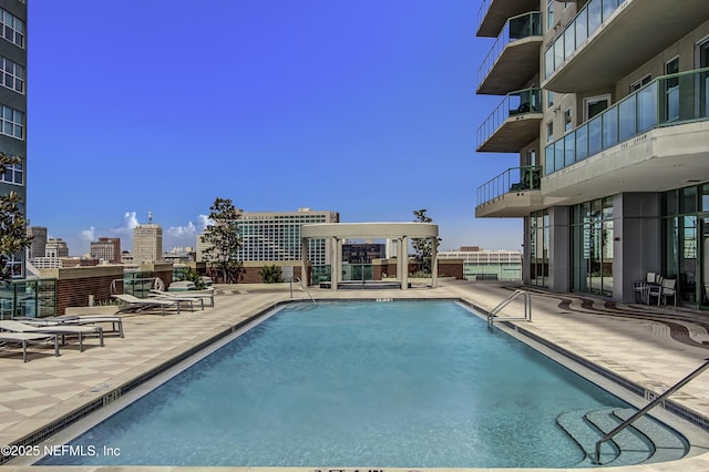 1431 Riverplace Blvd Unit 2105, Jacksonville, FL 32207 - pool featuring a city view and a patio area