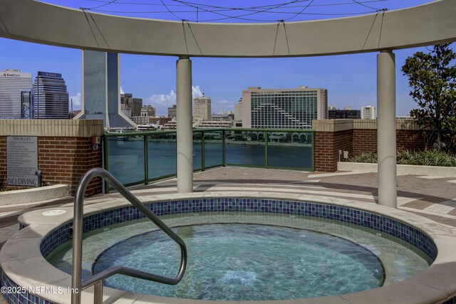 1431 Riverplace Blvd Unit 2105, Jacksonville, FL 32207 - view of swimming pool with a city view and a hot tub