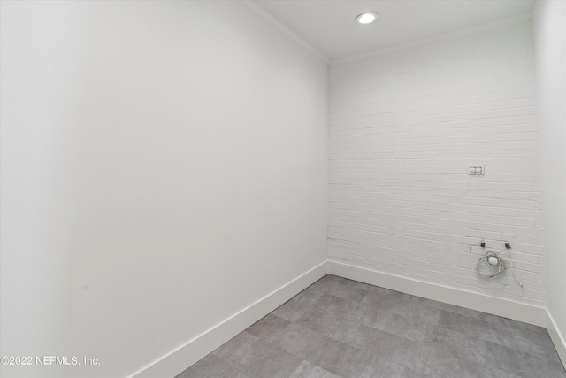 laundry area with crown molding