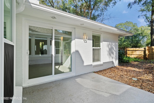 doorway to property with a patio area