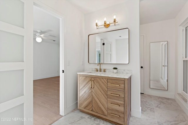 bathroom featuring ceiling fan, vanity, and hardwood / wood-style flooring