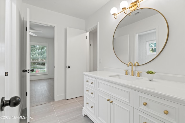 bathroom with ceiling fan, vanity, and wood-type flooring