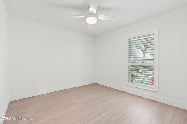 empty room featuring ceiling fan and light hardwood / wood-style floors