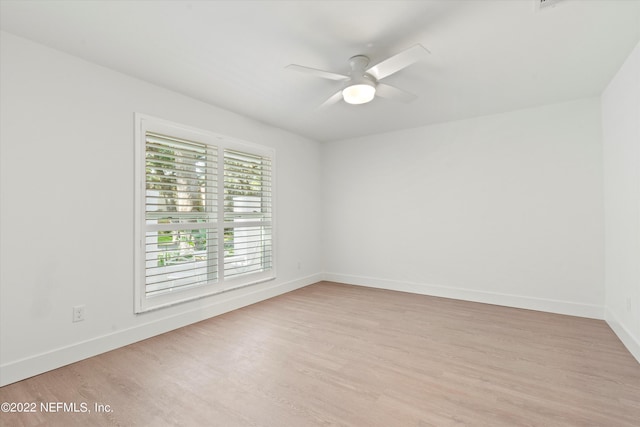 unfurnished room with ceiling fan and light hardwood / wood-style floors