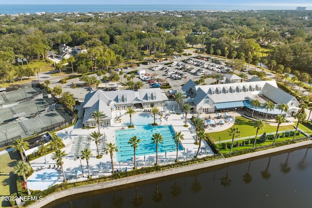 birds eye view of property with a water view