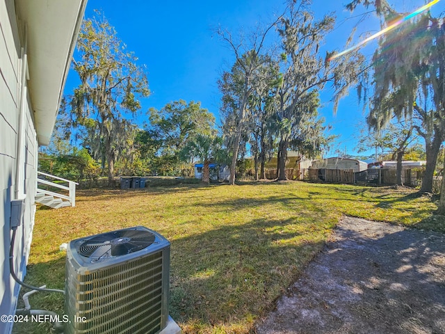 view of yard featuring central AC unit