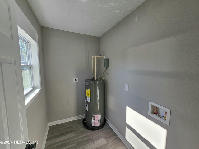 utility room featuring water heater