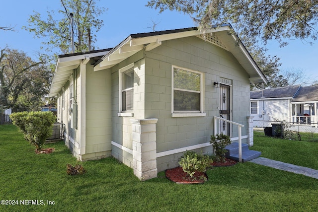 view of home's exterior featuring a lawn