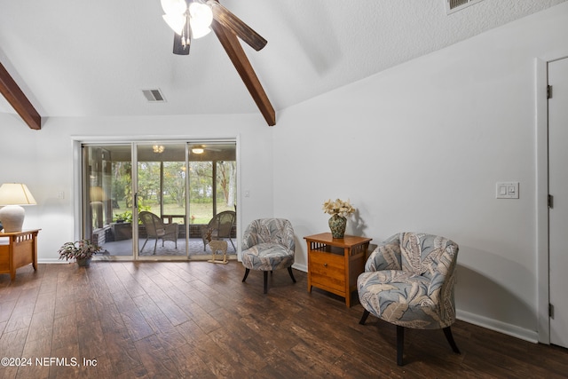 sitting room with a textured ceiling, ceiling fan, lofted ceiling with beams, and dark hardwood / wood-style floors