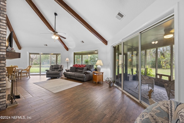 living room with ceiling fan, beam ceiling, dark wood-type flooring, and high vaulted ceiling