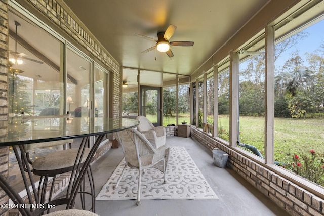 sunroom featuring ceiling fan