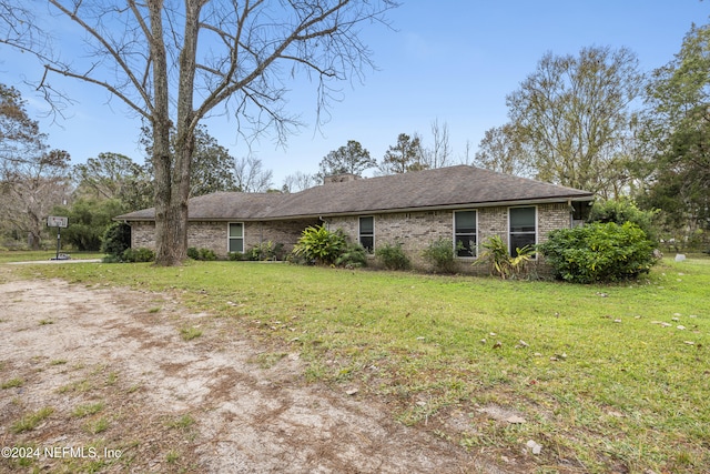 ranch-style home with a front lawn