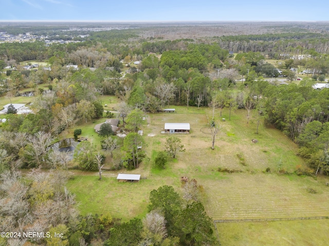 birds eye view of property with a rural view