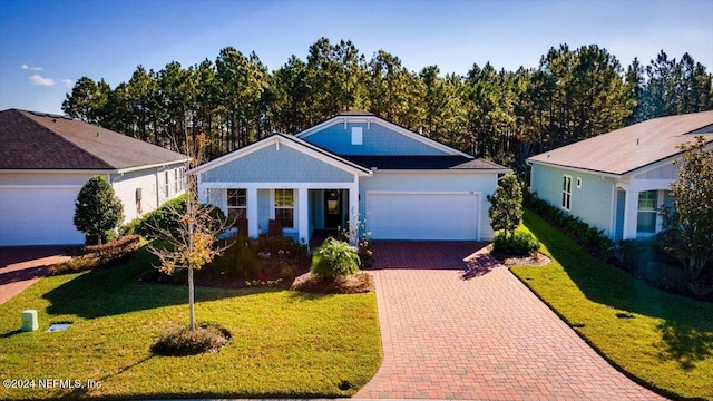 ranch-style house with a front yard and a garage