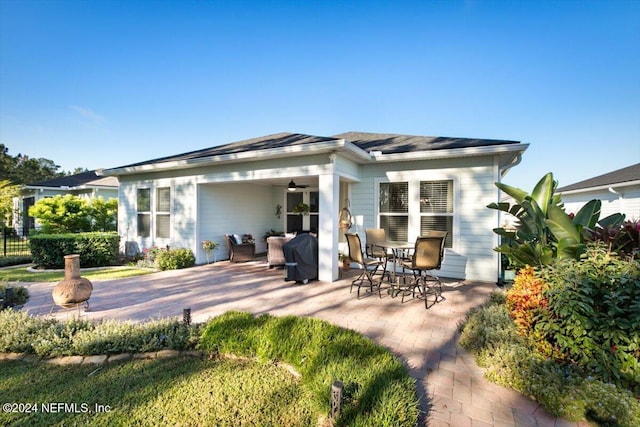 rear view of property featuring a patio