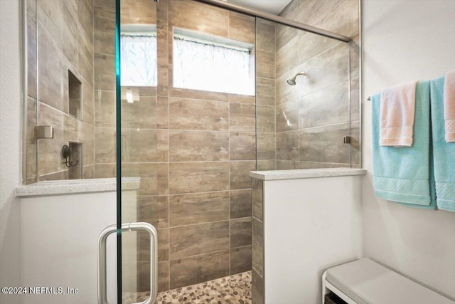 bathroom featuring walk in shower