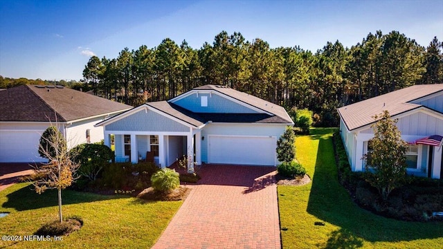 view of front facade with a garage and a front lawn