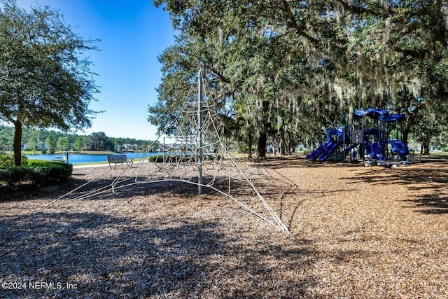 view of jungle gym featuring a water view