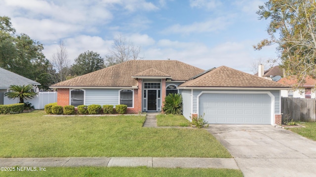 single story home with a garage and a front lawn