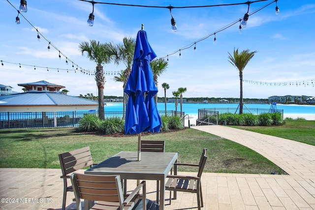 view of patio featuring a water view