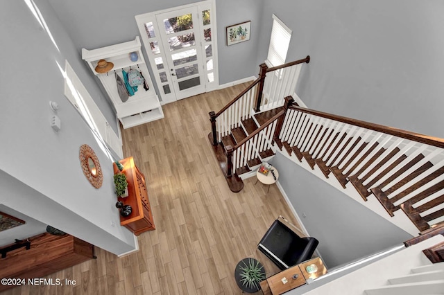 stairway with hardwood / wood-style floors