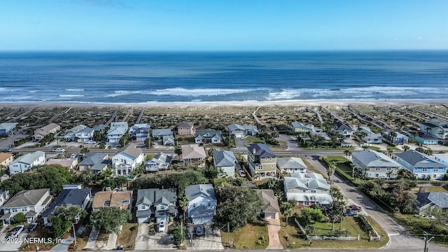 aerial view with a water view and a view of the beach