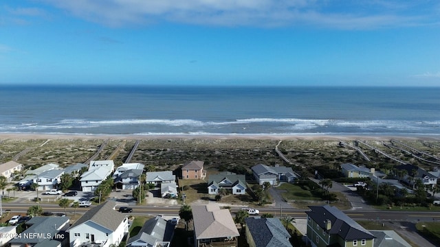 aerial view featuring a water view and a beach view