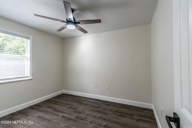 unfurnished room with ceiling fan, dark hardwood / wood-style flooring, and a textured ceiling