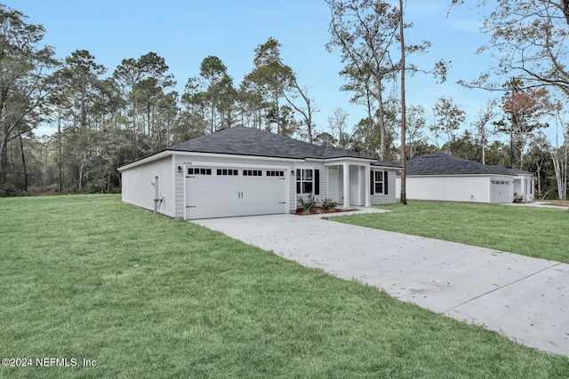 single story home featuring a garage and a front yard