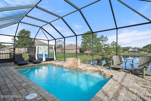 view of swimming pool with a lanai, a patio area, pool water feature, and a water view