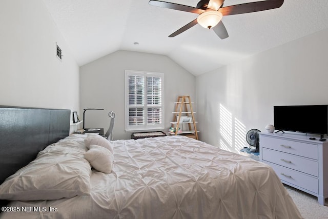 bedroom with light carpet, ceiling fan, and lofted ceiling