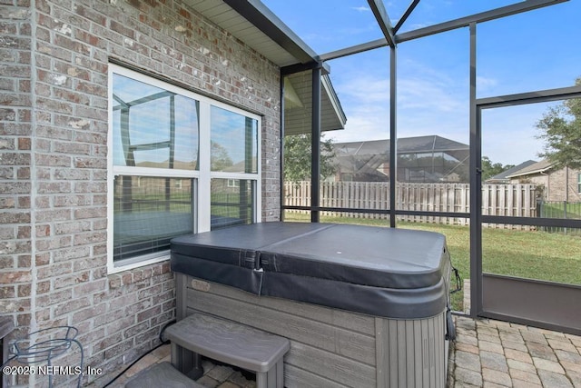 sunroom / solarium with a jacuzzi