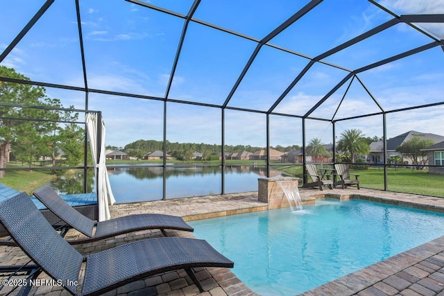 view of pool featuring pool water feature, a water view, a patio area, and a lanai