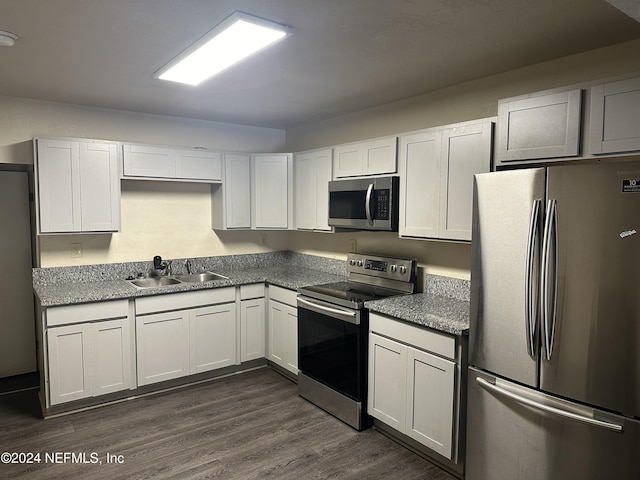 kitchen featuring sink, white cabinets, and appliances with stainless steel finishes