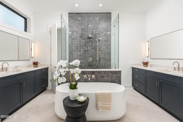 bathroom with separate shower and tub, tile patterned floors, and vanity