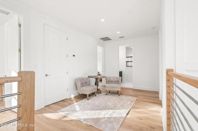 sitting room featuring light hardwood / wood-style floors