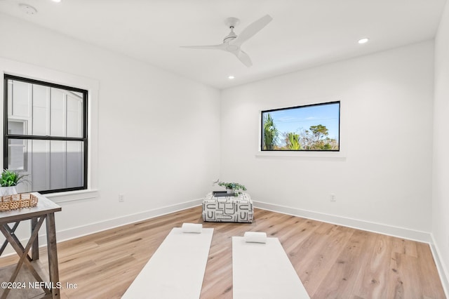 living area featuring ceiling fan and light wood-type flooring