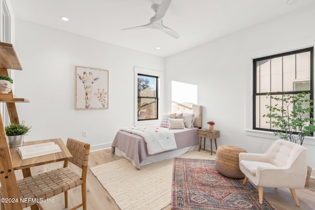 bedroom featuring ceiling fan and light hardwood / wood-style flooring