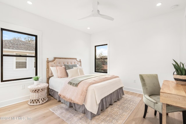 bedroom with ceiling fan and light wood-type flooring