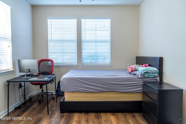 bedroom featuring dark hardwood / wood-style flooring